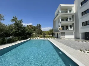 Apartments in a residential complex with a swimming pool near the sea